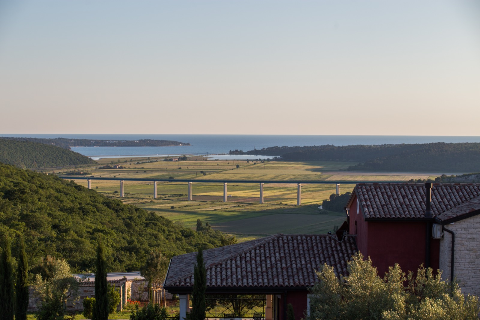 The Mirna valley opening to the Adriatic on the horizon, seen from nearby hills